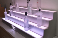 four_step_led_bar_shelf_white_close_angle